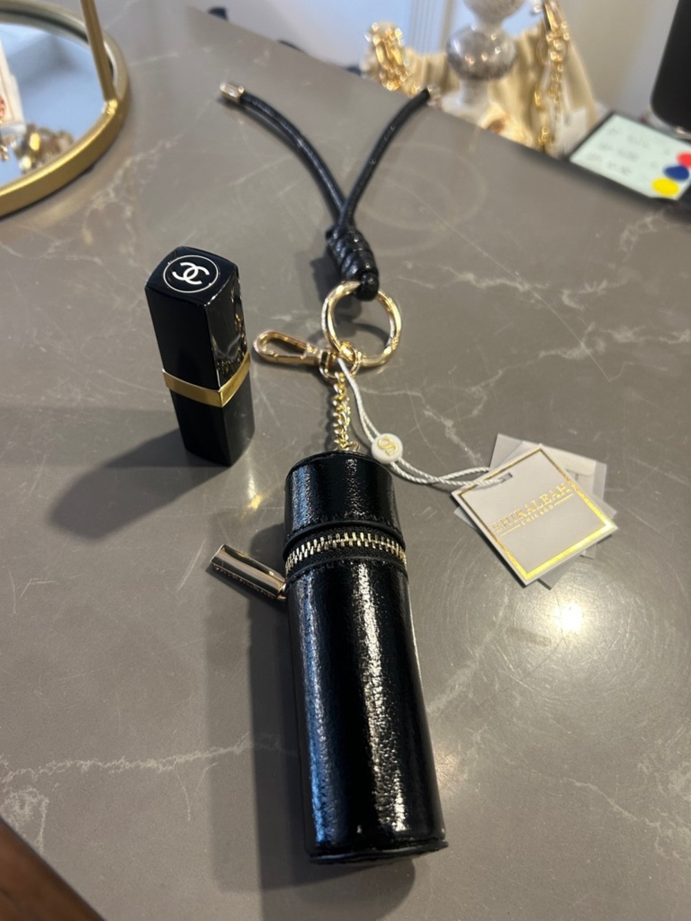 Shiraleah Black Patent Lipstick Case Keychain with Gold Hardware - Picture 2 of 11